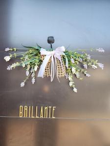 a wreath of flowers is hanging from a ceiling at Paju Espacio Brillante in Paju