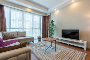 Μια τηλεόραση ή/και κέντρο ψυχαγωγίας στο Luxury Residence in Sirius Town Pool & Spa