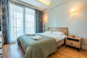 Ένα ή περισσότερα κρεβάτια σε δωμάτιο στο Luxury Residence in Sirius Town Pool & Spa