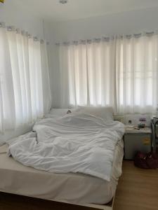 Postel nebo postele na pokoji v ubytování T-home Maerim + 4 fotografie