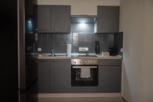 Kuchyň nebo kuchyňský kout v ubytování Stilvolles Apartment mit Balkon & WiFi