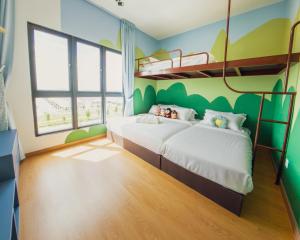 Postel nebo postele na pokoji v ubytování MayaBay Homestay near KLIA SplashMania at Gamuda Cove by GL Play + 76 fotografií