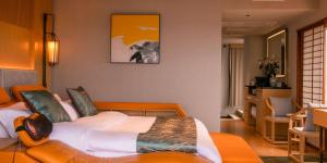 Ένα ή περισσότερα κρεβάτια σε δωμάτιο στο Tsuru Yoshikawa Onsen