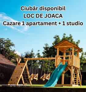 a wooden playground with a slide and a gazebo at FLH - Citadel Garden Central Free Parking in Alba Iulia