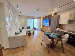 a living room with a couch and a table at Luxury 1 bedroom at La marina in Casablanca