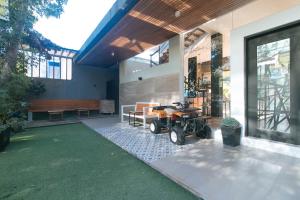a house with a motorcycle parked outside of it at RedDoorz at Anton's Loft Designer Resort Pansol Calamba Laguna in Laguna