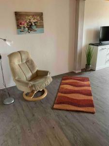 TV a/nebo společenská místnost v ubytování Ferienwohnung mit Dachterrasse