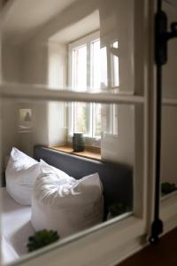 Ένα ή περισσότερα κρεβάτια σε δωμάτιο στο Lehm & Fachwerk 2-Zimmer-Apartment - Claycation