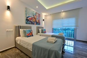 Ένα ή περισσότερα κρεβάτια σε δωμάτιο στο YAĞIZ-Villa with Children's Pool&Jacuzzi for 6 People in Gocek +39 φωτογραφίες