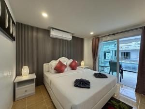 Ένα ή περισσότερα κρεβάτια σε δωμάτιο στο Inn Dulgence