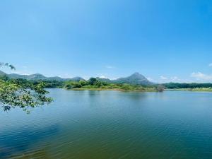 a view of a river with mountains in the background at DropHaus in Naula