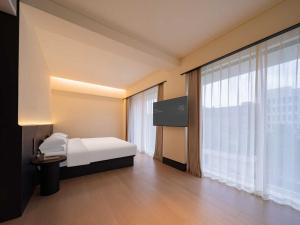 Μια τηλεόραση ή/και κέντρο ψυχαγωγίας στο Yunyi Zizai Hotel Hohhot Agricultural University Branch