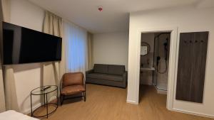 TV a/nebo společenská místnost v ubytování Müllerbräu Braugasthof