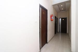 a hallway with a fire hydrant in a building at Super Hotel O by OYO Surya Continental in Lucknow