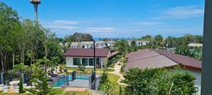 an aerial view of a resort with a building at Samati Hill - Sunset Pool Villa 6 - Klong Ning Beach in Ko Lanta Yai