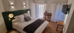 Postel nebo postele na pokoji v ubytování A L'Esquirot