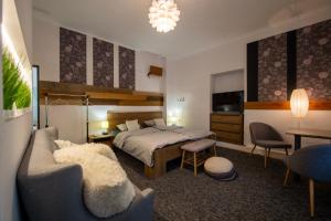 Postel nebo postele na pokoji v ubytování Apartmány Caffe & Grill