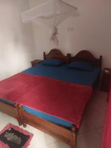 Giường trong phòng chung tại Palm Trees