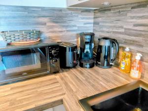 Una cocina o cocineta en Grand appart proche des plages Parking privé