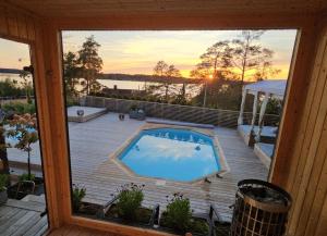 a view of a swimming pool from a window at Privat Spirit Spa Villa in Vallentuna