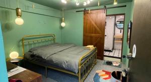 Ένα ή περισσότερα κρεβάτια σε δωμάτιο στο Leo Ho Hostel