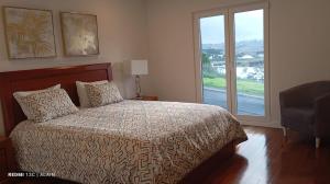a bedroom with a bed and a large window at Villa Lina in Lourinhã +18 photos