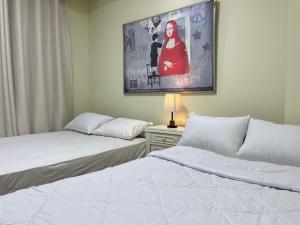 Ліжко або ліжка в номері The Address Modern apartment +55 фото