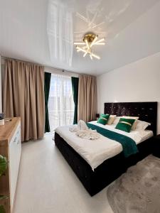 Postel nebo postele na pokoji v ubytování Ultracentral Piata Victoriei 50- City Center View