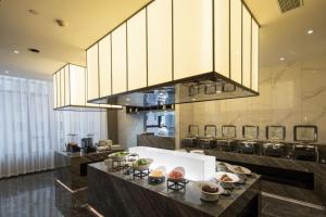 Kuchyň nebo kuchyňský kout v ubytování Jin Yi Youxuan Hotel Jungar Banner Government Branch