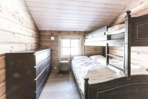 Ένα ή περισσότερα κρεβάτια σε δωμάτιο στο Stranda Fjellgrend 3 bedrooms - 68A