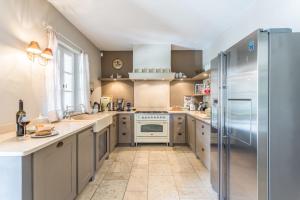 Kuchyň nebo kuchyňský kout v ubytování Au Cœur de la Pinède