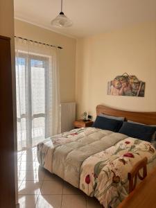 Ένα ή περισσότερα κρεβάτια σε δωμάτιο στο Nonno Pierino affittacamere