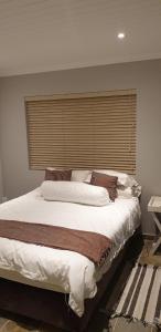 En eller flere senge i et værelse på Windswael 3 + 14 billeder