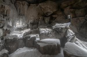 a cave with snow and ice on the rocks at Skostredet Hotel & Spa in Bergen