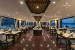 a restaurant on a cruise ship with tables and chairs at Majesty Luxury Prime Cruise by Premier Group in Ha Long +54 photos