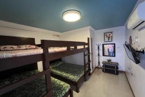 Giường trong phòng chung tại Kakay Beach Resort +65 ảnh