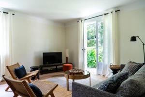 Гостиная зона в Appartement pour 6 personnes- Villa LOU BOUSQUET étage