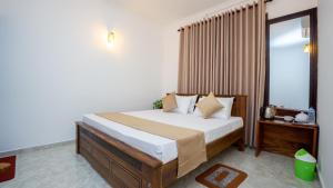 Ένα ή περισσότερα κρεβάτια σε δωμάτιο στο Green Serenity