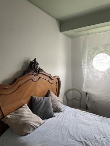 En eller flere senge i et værelse på Appartement aménagée Terrasse étoilée 20 mn des Champs-Elysées, Park