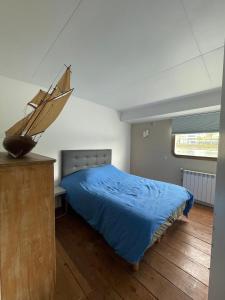 En eller flere senge i et værelse på Appartement aménagée Terrasse étoilée 20 mn des Champs-Elysées, Park