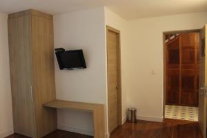 TV a/nebo společenská místnost v ubytování Casa Hotel Boyaca Real