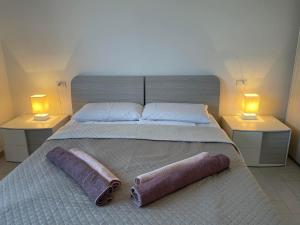 Кровать или кровати в номере Amicizia