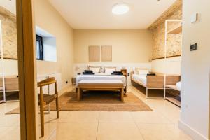 Кровать или кровати в номере Casa Rural En El Balcón Del Delta Del Ebro +12 фотографий