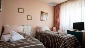 Ένα ή περισσότερα κρεβάτια σε δωμάτιο στο Angelina Square Home