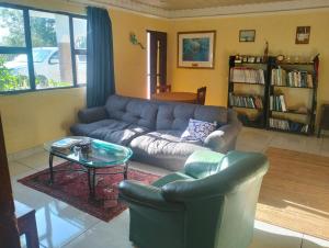 a living room with a couch and a coffee table at Pro Rig in Sodwana Bay