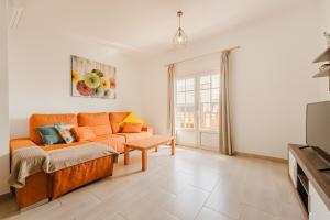 a living room with a couch and a table at Apartment Old Town Reina Sofia 1 in Puerto del Carmen