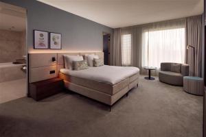 Ένα ή περισσότερα κρεβάτια σε δωμάτιο στο Van der Valk Hotel Lelystad +25 φωτογραφίες