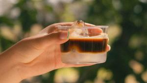 a hand holding a glass container filled with food at Tenuta Doxi in Gallipoli