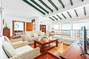 a living room with couches and a table at Villa Casa Bonita by Villa Plus in Alaior