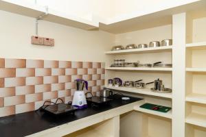 Kuchyň nebo kuchyňský kout v ubytování Live Inn RMS